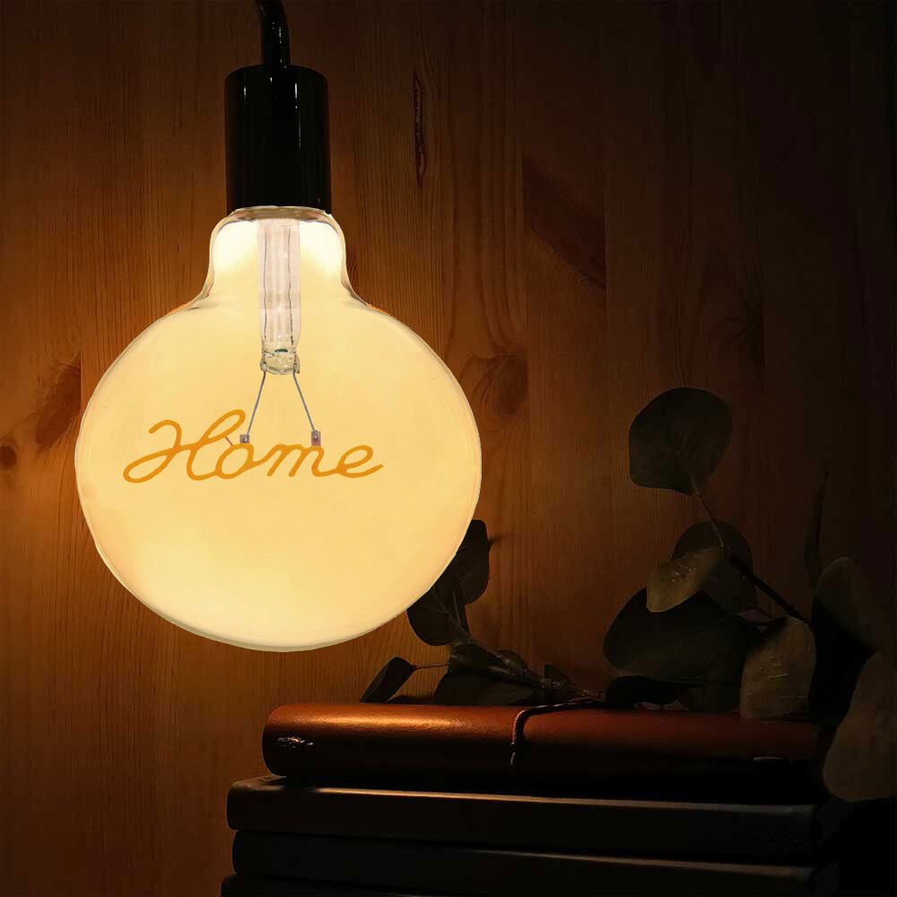 Lampadina ambrata con led a filamento che crea la scritta HOME 4 watt E27 lampada decorativa stile vintage luce calda 2500k