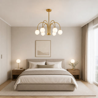 Lampadario moderno oro con 6 bracci curvi 6 sfere bianche attacco G9