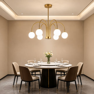 Lampadario moderno oro con 6 bracci curvi 6 sfere bianche attacco G9